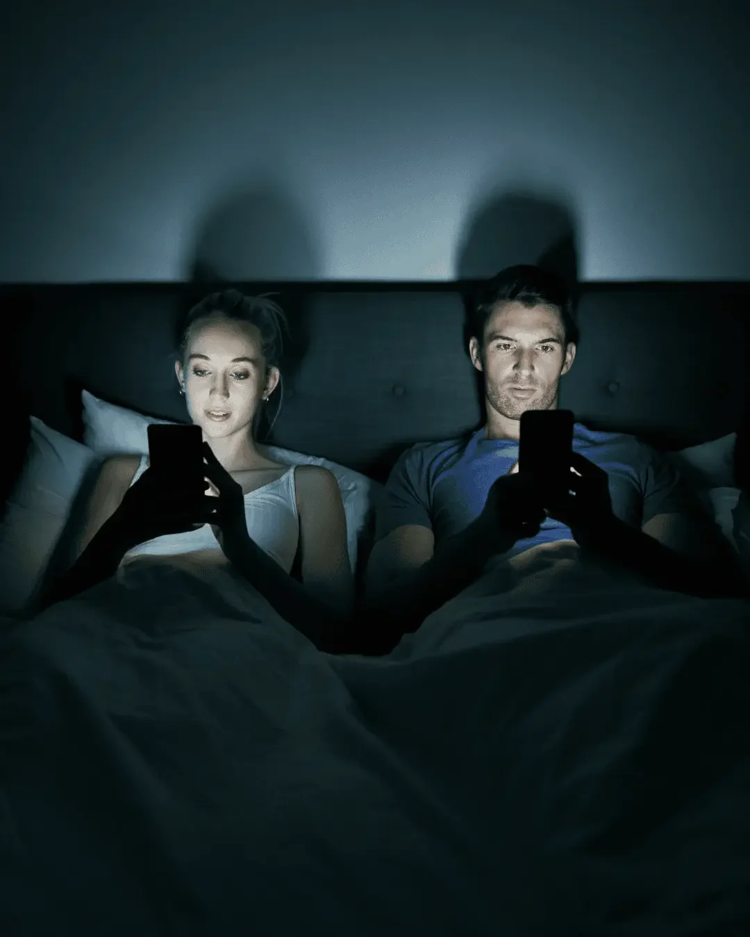 homeowners looking at there phone at night