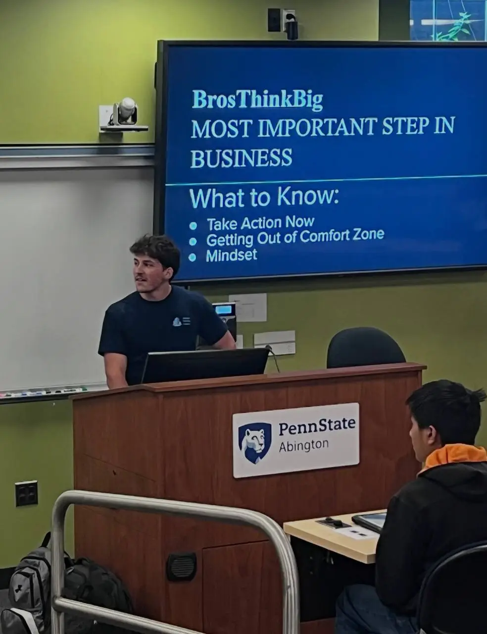 josh at penn state abington a grass field with trees in the background and a beautiful sunset